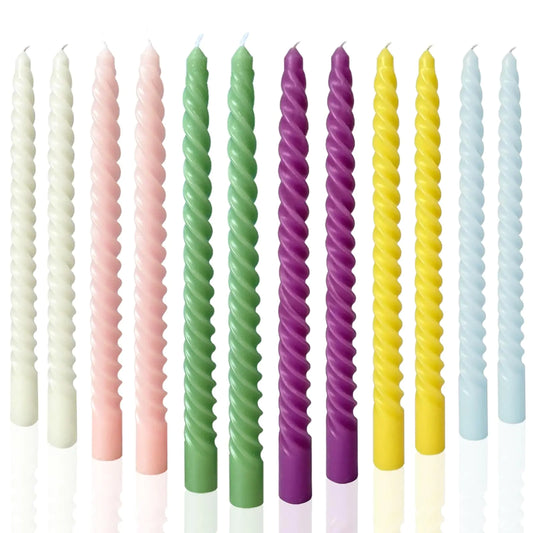 Taper candles lit on a table