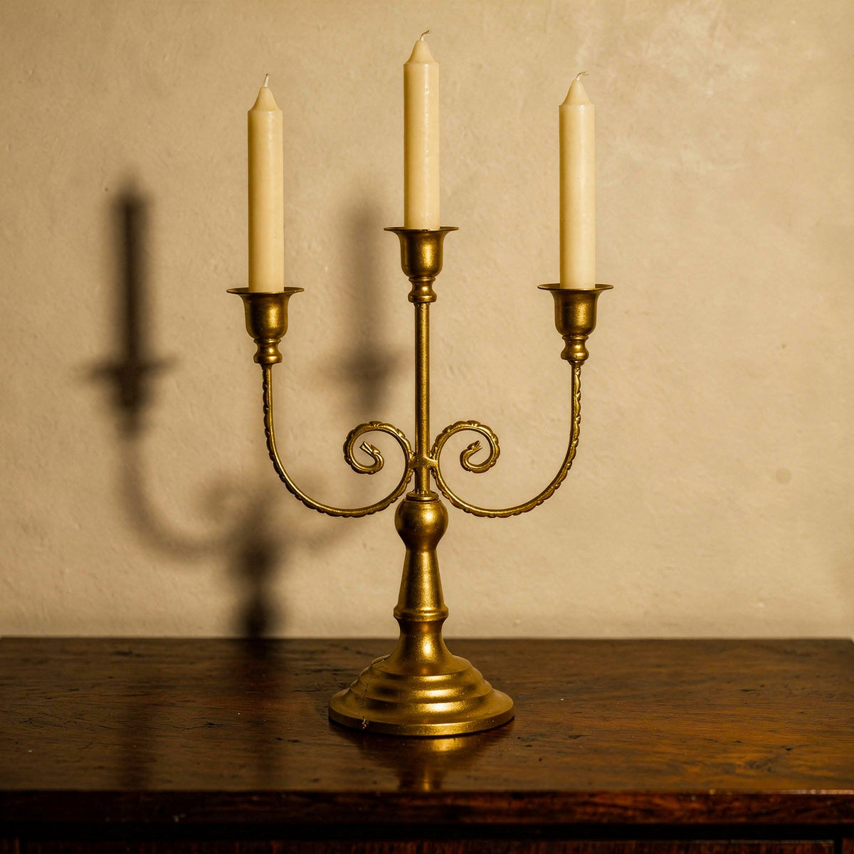 Three-arm gold candelabra