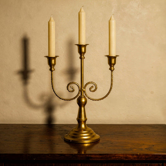 Three-arm gold candelabra