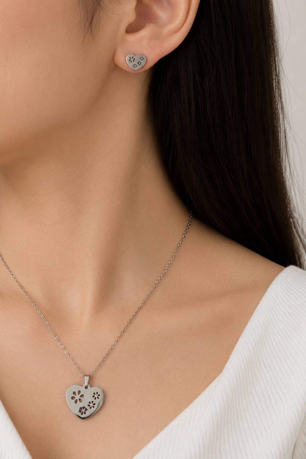 Silver-tone heart necklace and earring set with flower detail