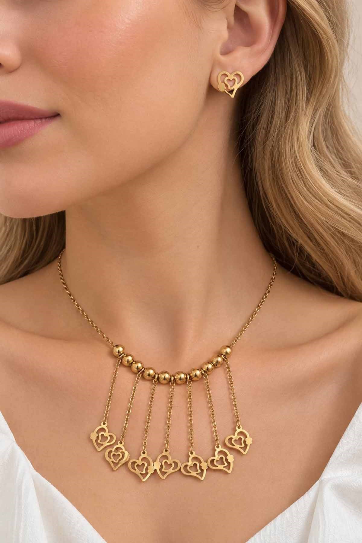 Gold-tone heart necklace and earring set with ball detail